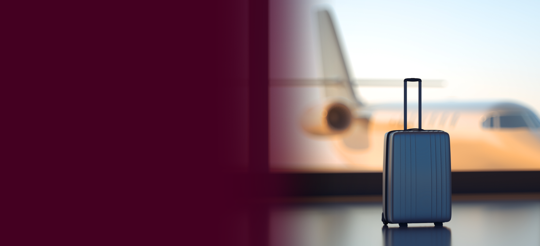 suitcase in an airport with a plane in the background