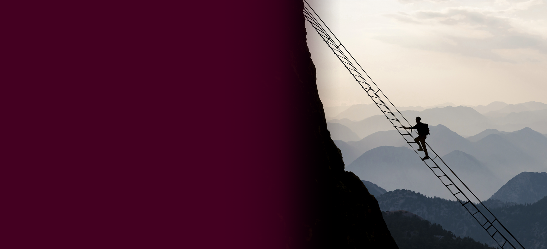 silhuette of a person hiking of a steep ladder leading to the top of a vertical cliff-face