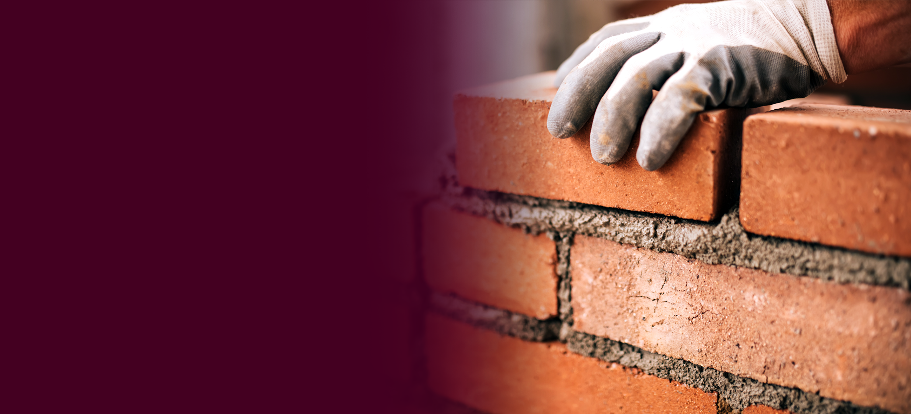 Close up of a construction worker laying bricks