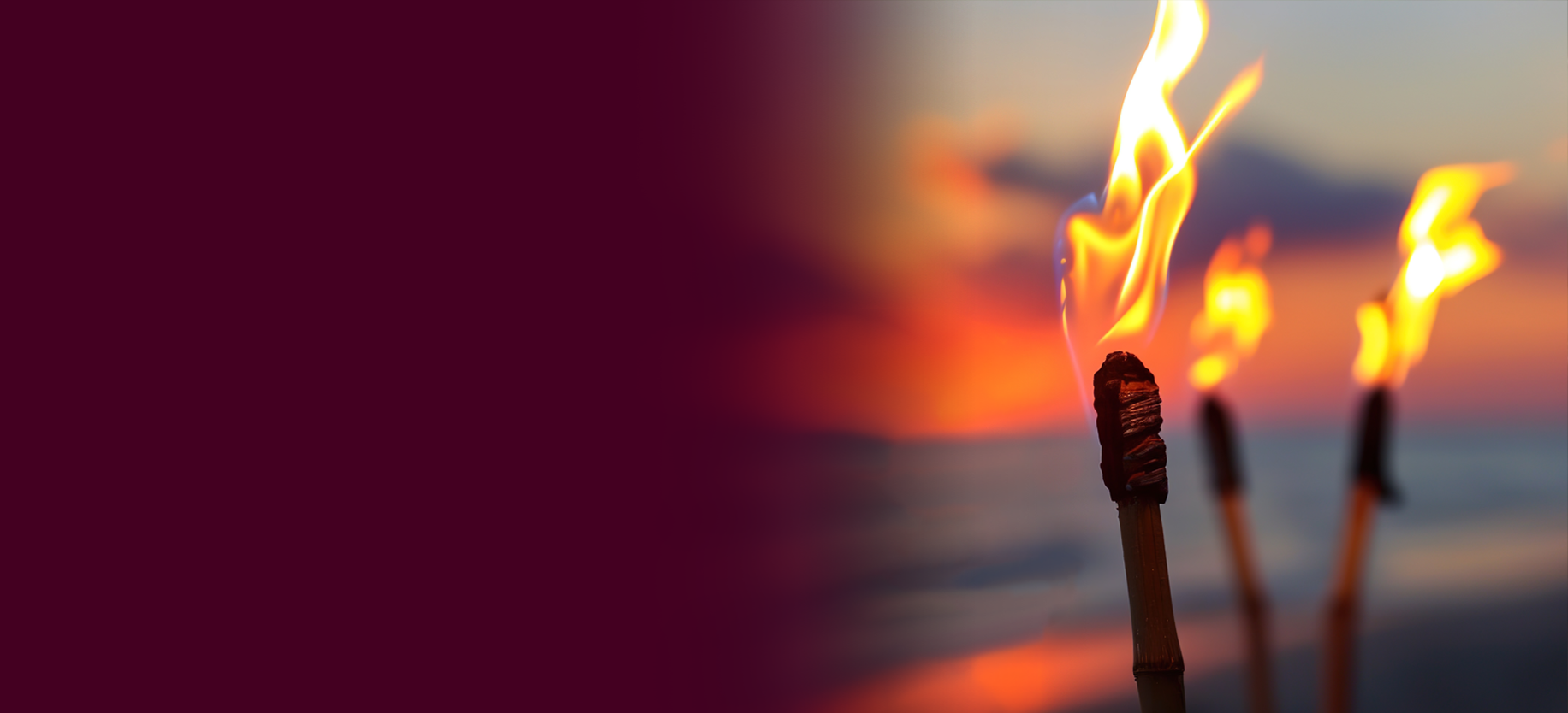 Tiki torch on a beach at sunrise