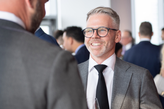 Stephen Shuttleworth speaking with clients at the Burgundy Forum